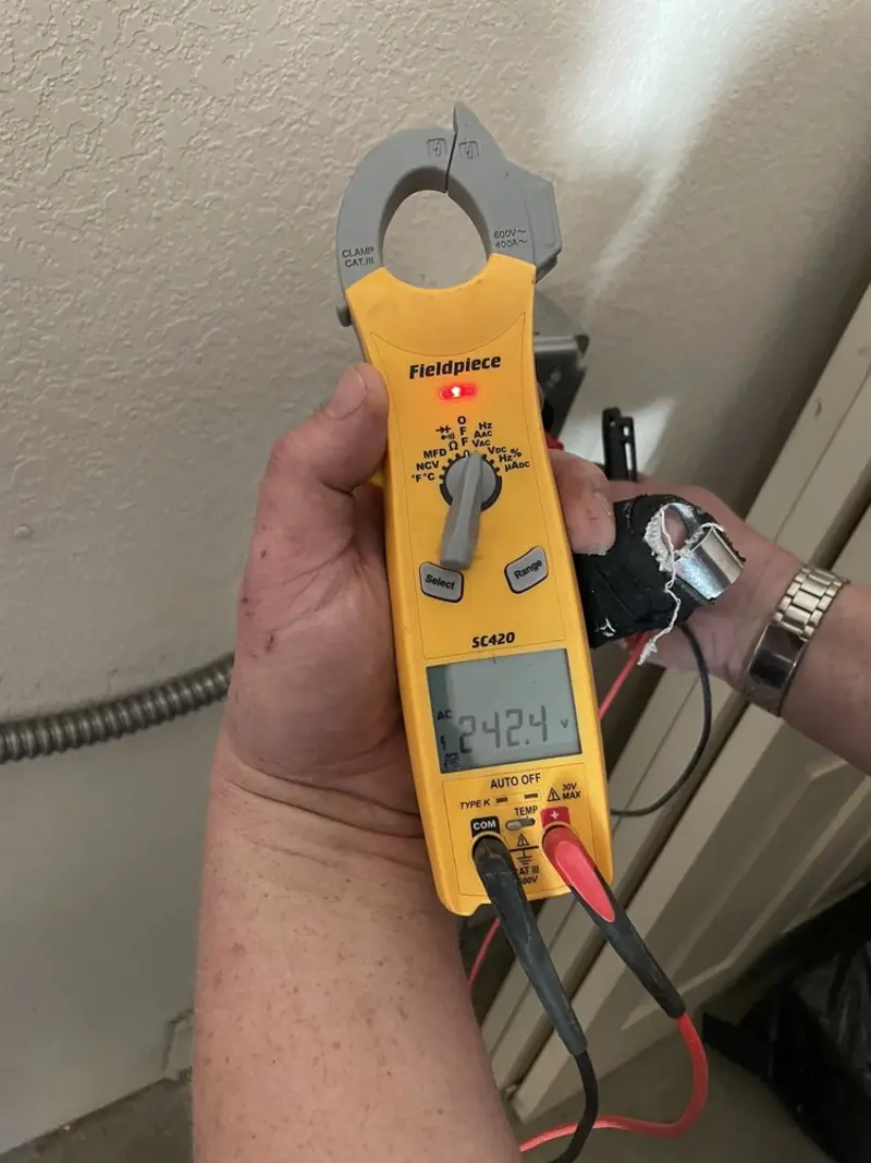 Voltage testing with clamp meter during Outlet Installation in Hesperia